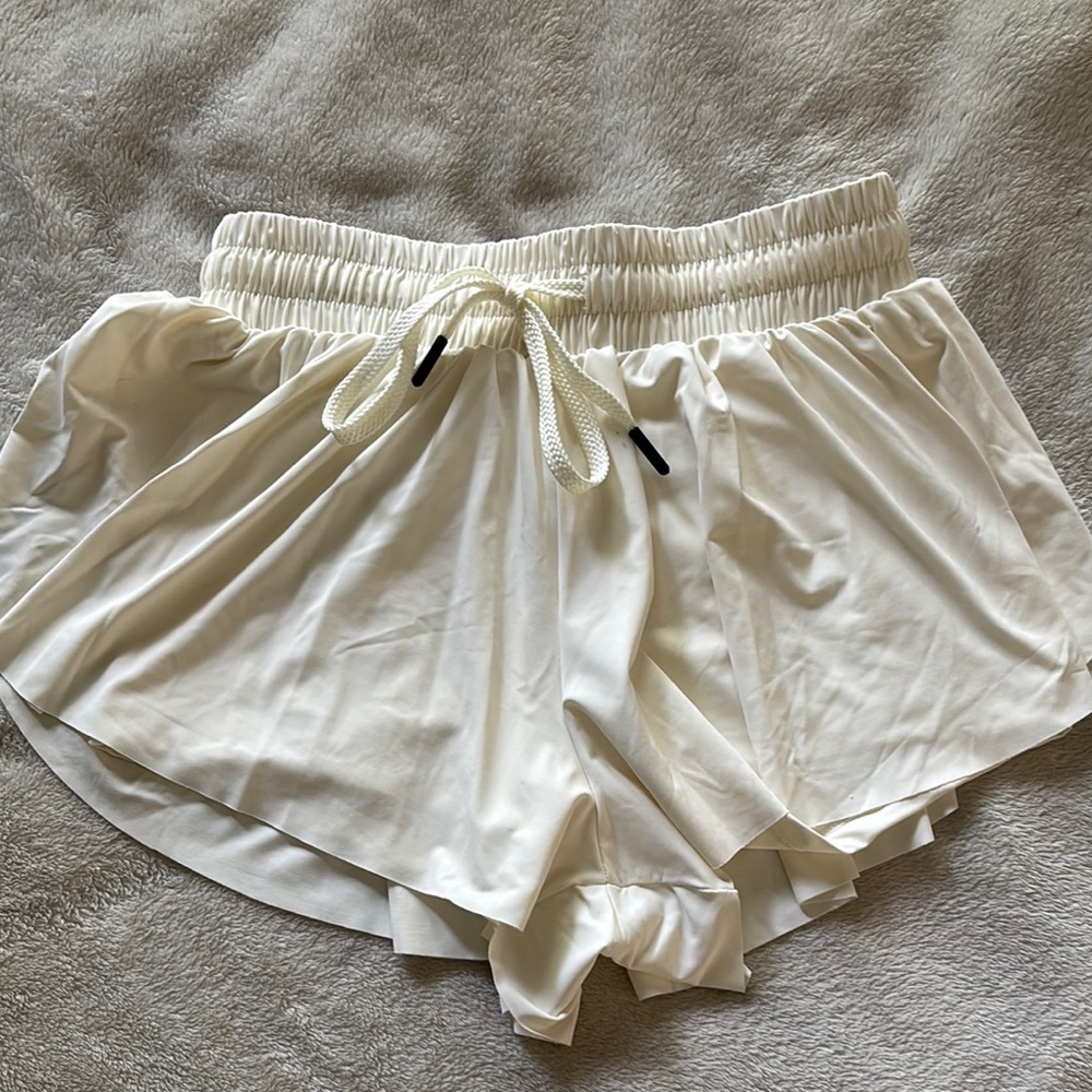 Cream Athletic Shorts with Elastic Waistband and Lightweight Fabric